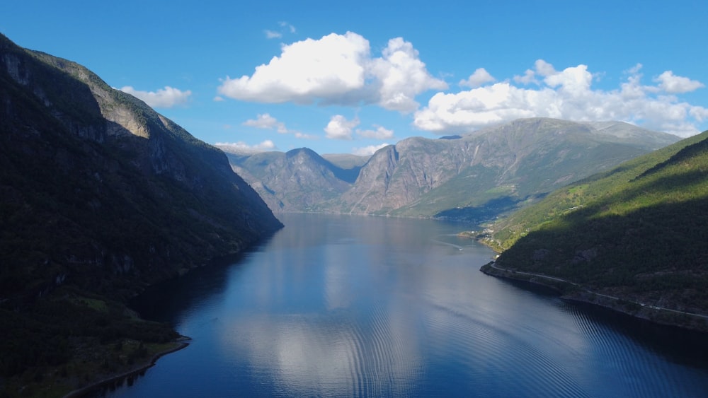 a body of water surrounded by mountains with Doubtful Sound in the background