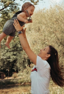 a person holding a baby