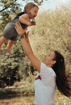 a person holding a baby