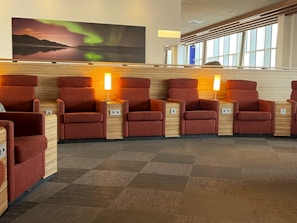 A cozy corner of Salon 12 with plush chairs and warm lighting inviting clients to relax.