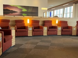 Relaxation zone with comfortable seating and soft gold accent lighting creating a welcoming atmosphere.