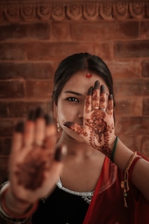 a woman with her hand on her face