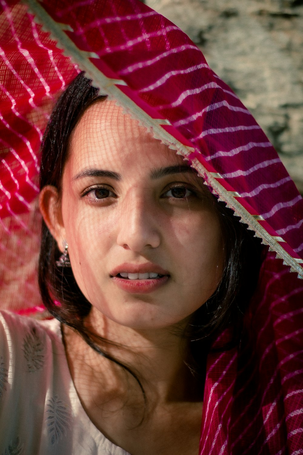 a person with a red and white headdress