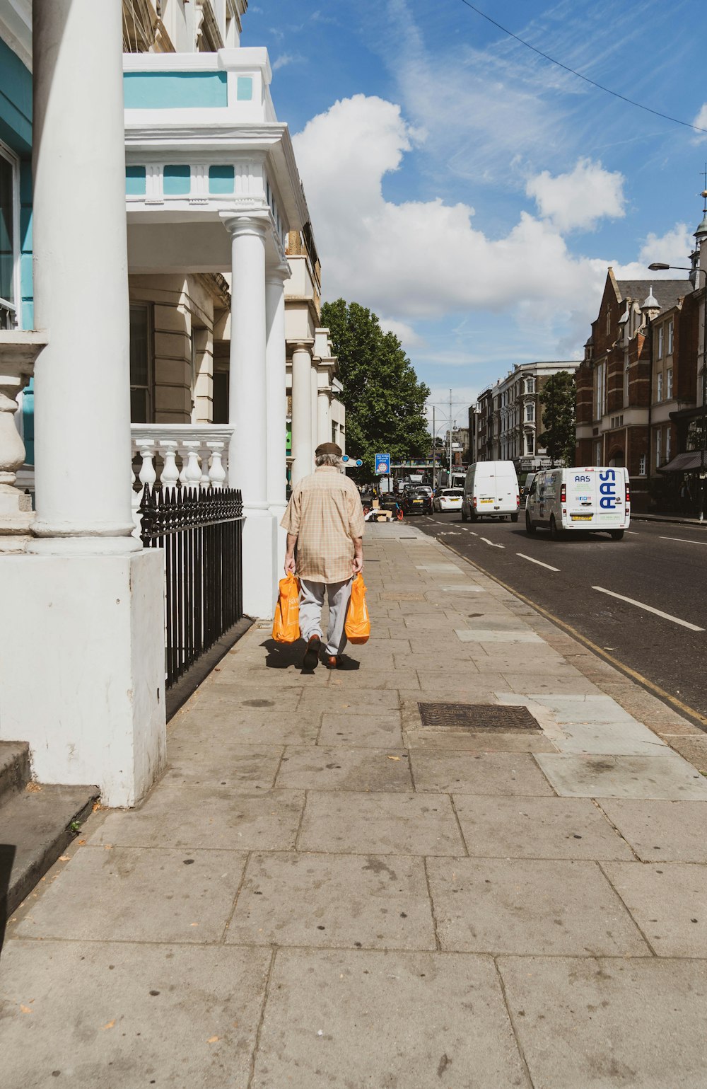 a person walking down a sidewalk