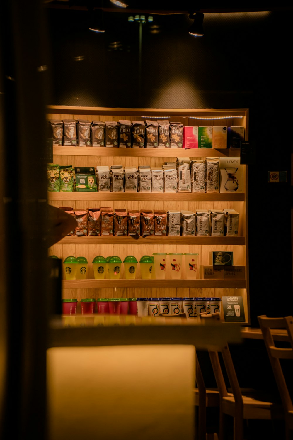 a shelf with many jars of food on it