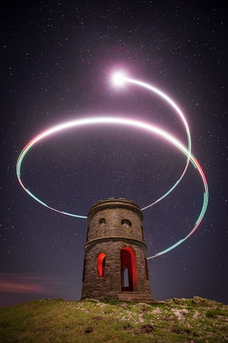 a tower with lights in the sky