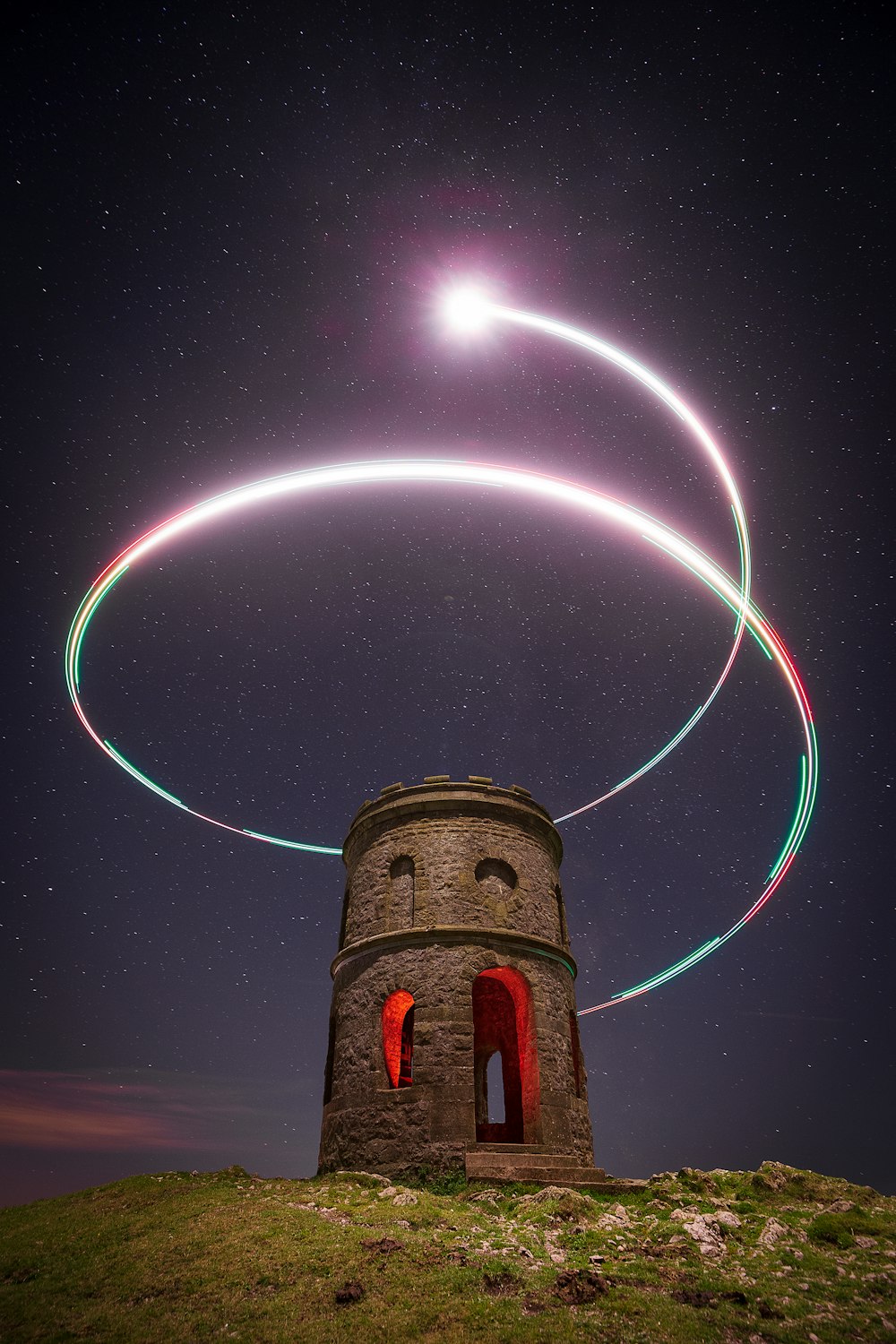 a tower with lights in the sky