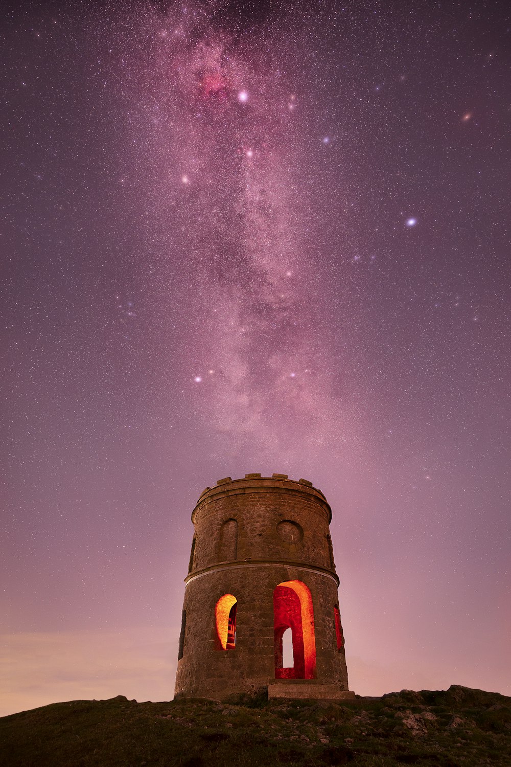 a tower with a star in the sky above it