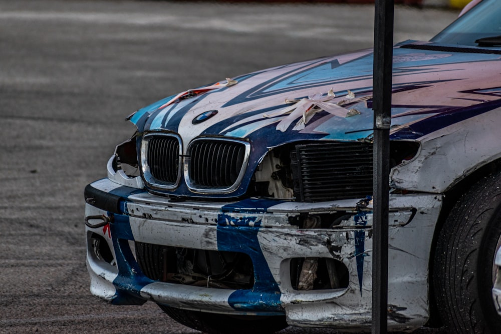 a blue car with a black grill