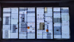 Documents and charts spread on a desk showing property valuation data