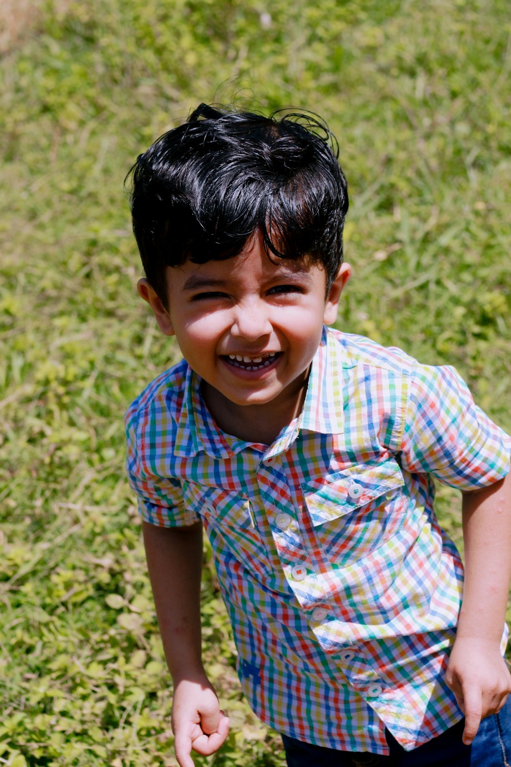 a boy smiling at the camera