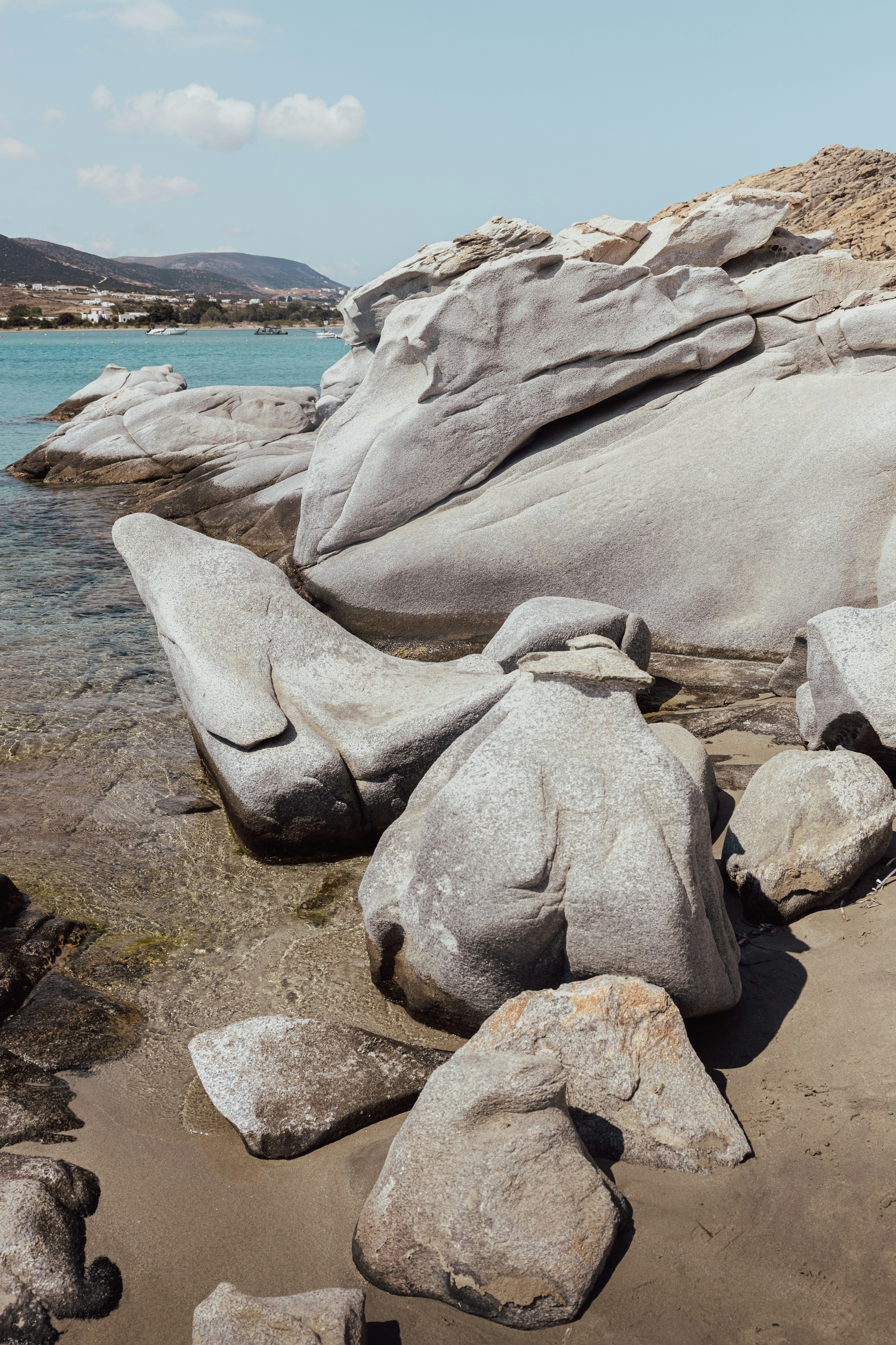 A group of rocks on a beach photo – Free Grey Image on Unsplash