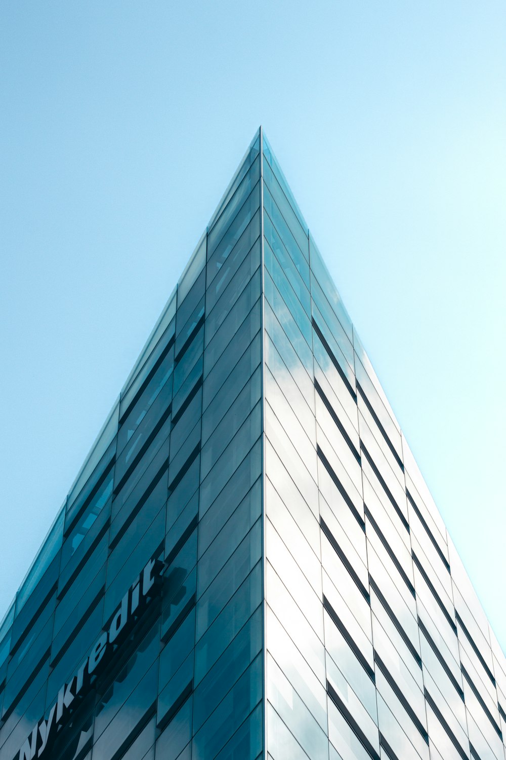 a tall building with glass windows