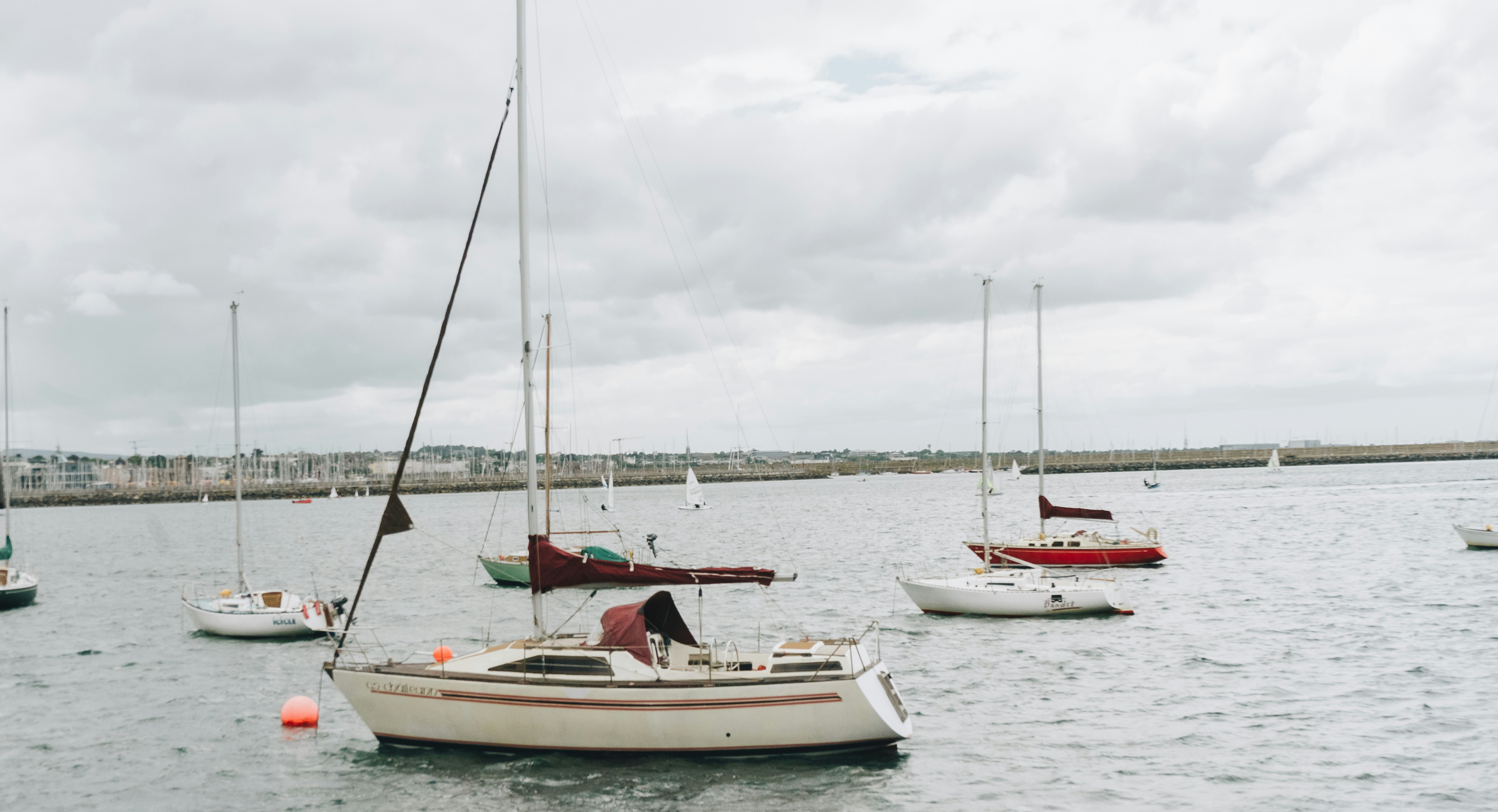 a group of boats in a harbor
