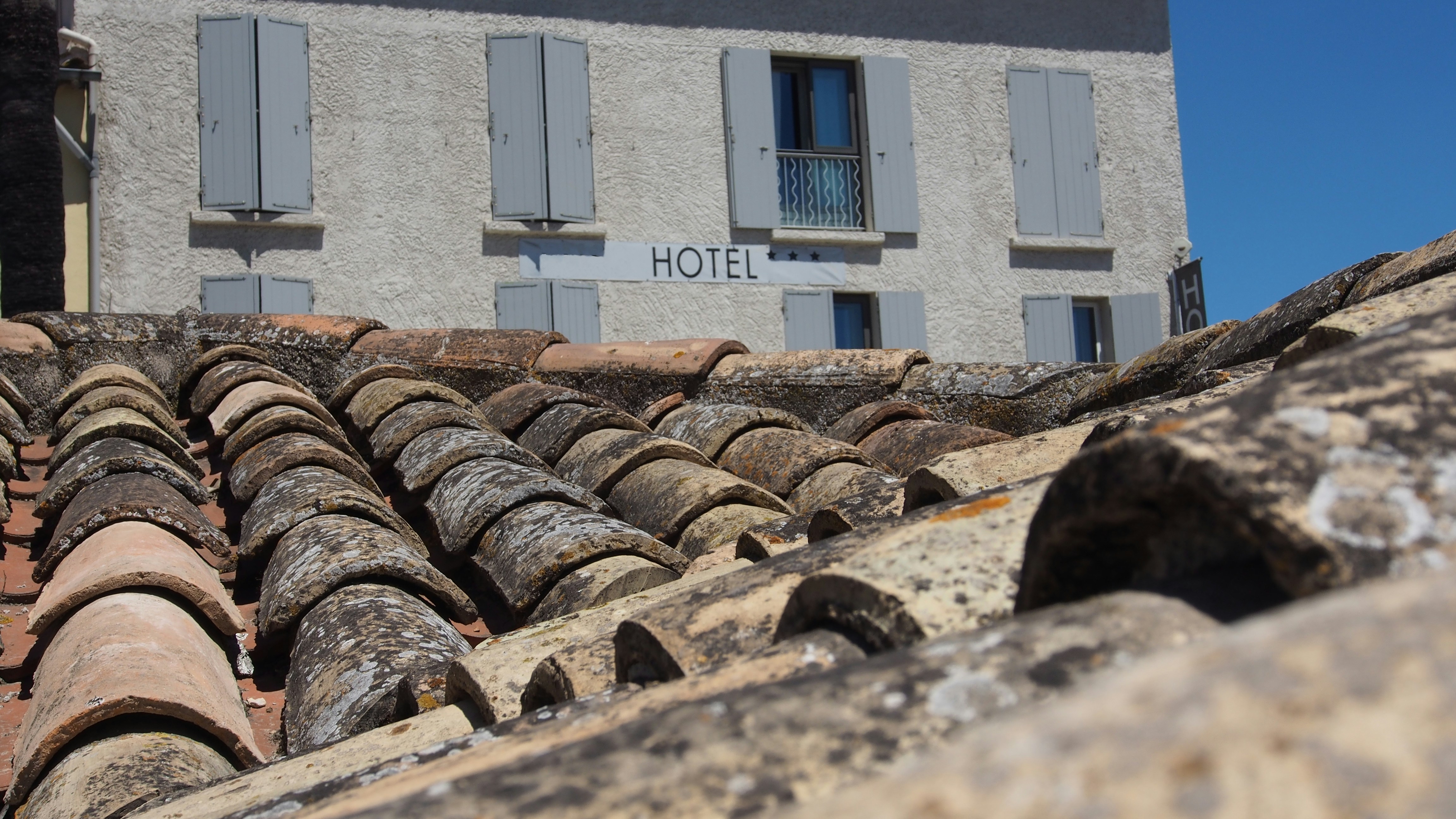 a building with a stone wall