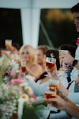 a group of people holding glasses of wine