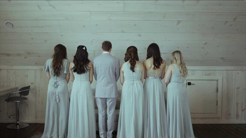 a group of people in white dresses
