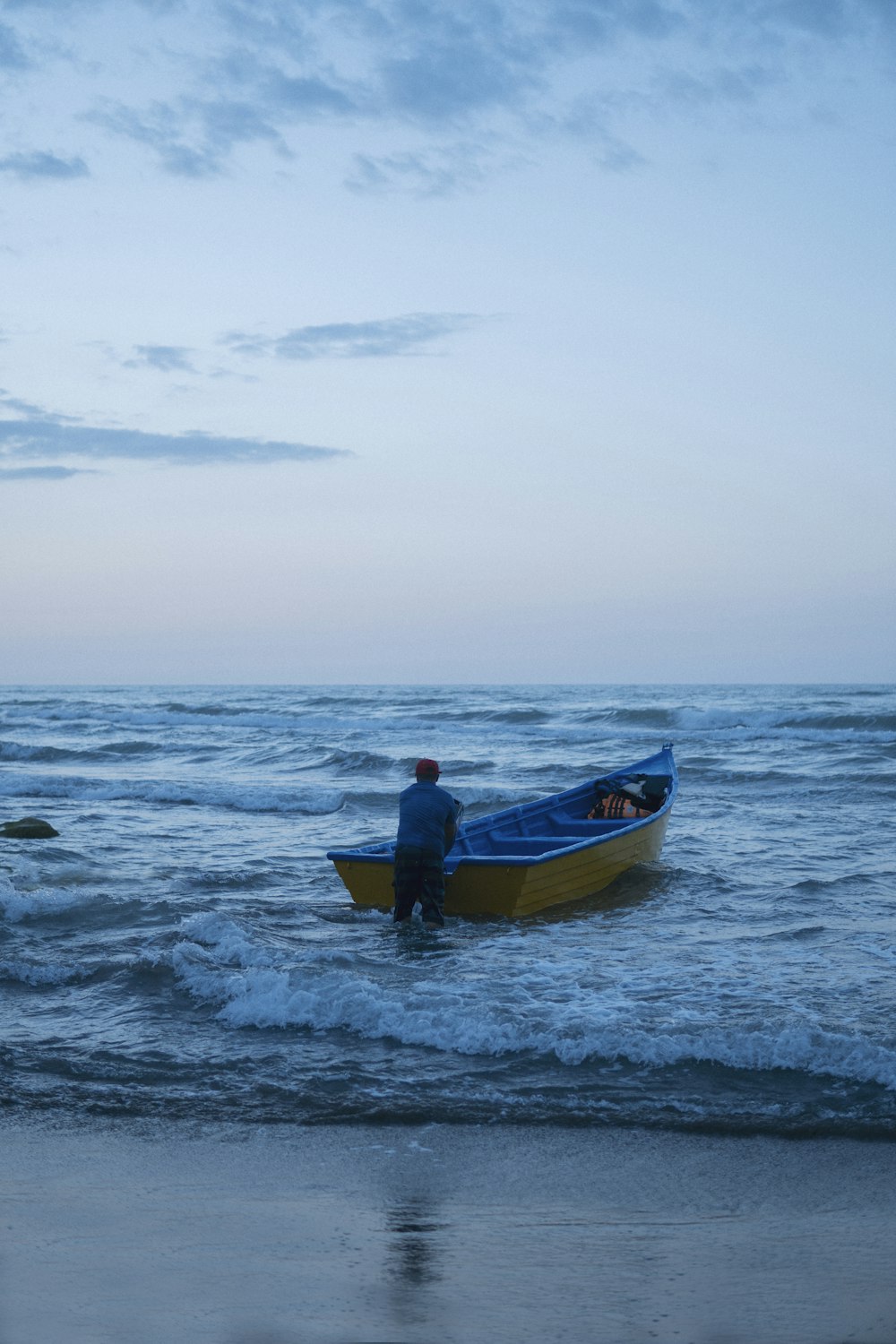 a person standing on a boat in the ocean