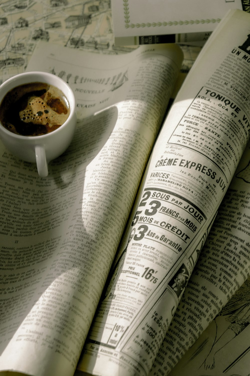 a cup of coffee and a newspaper