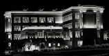 Night view of Neeladri Nivas with soft lighting highlighting the building’s facade.