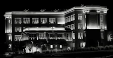 Night view of Neeladri Nivas with soft lighting highlighting the building’s facade.
