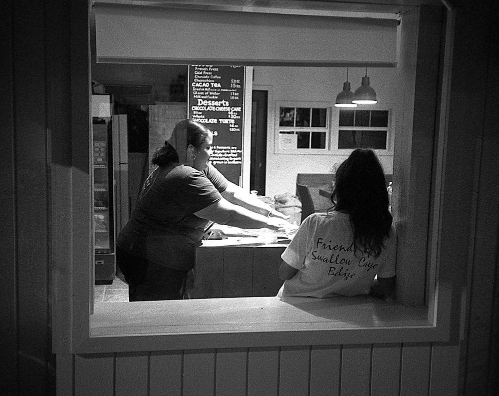 a couple of women in a restaurant