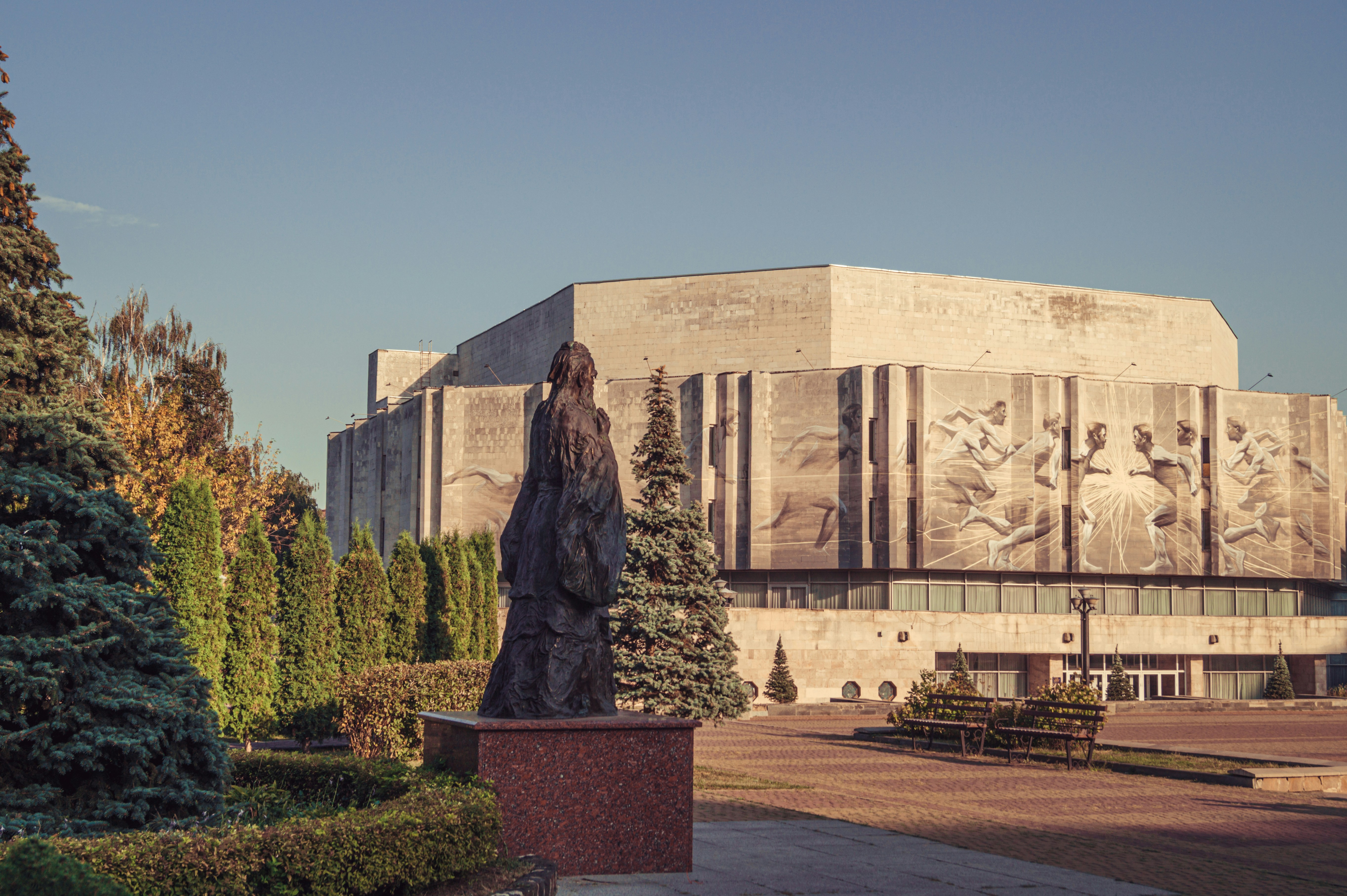 a statue in front of a building
