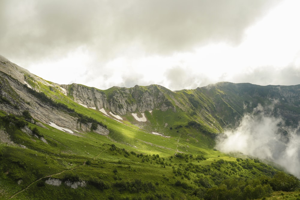 a valley with a waterfall