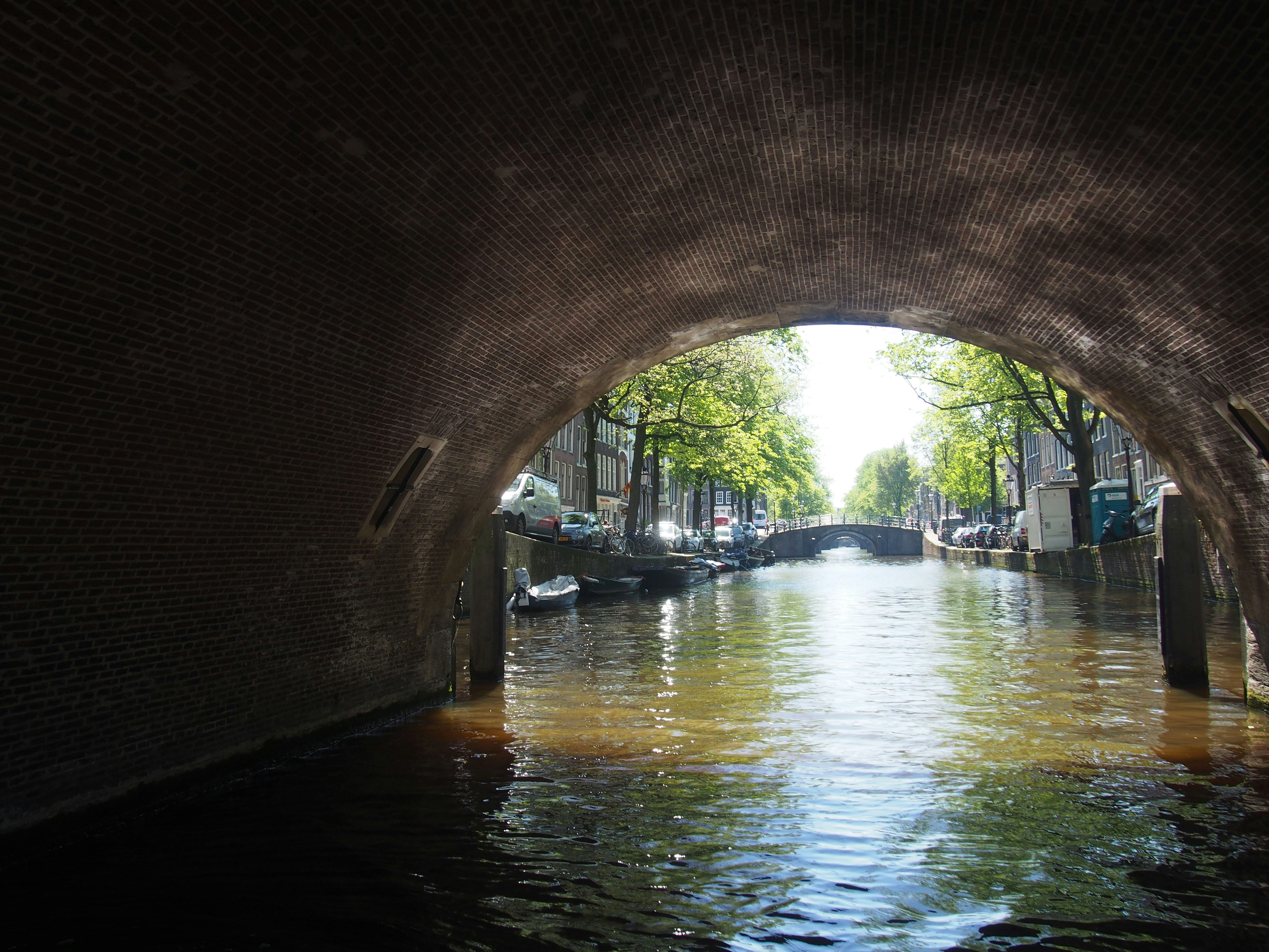 a canal with boats and buildings, 