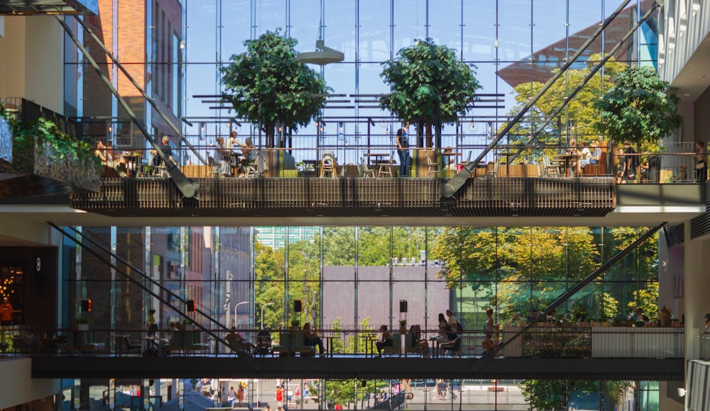 a group of people walking around a building