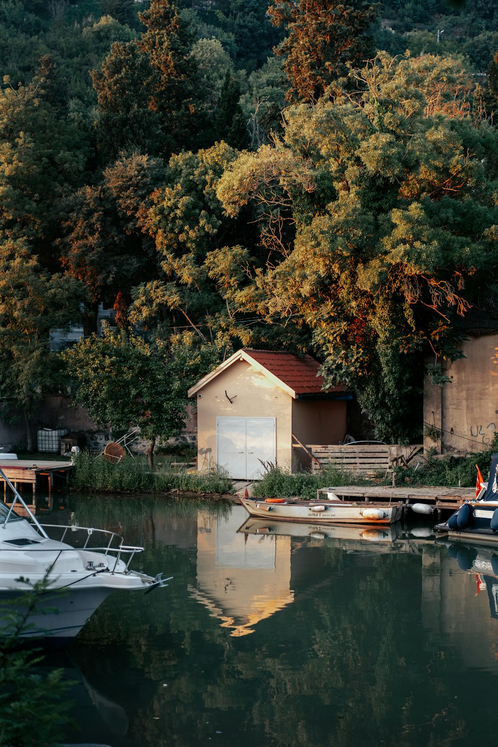 a small house next to a lake