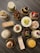 Close-up of a beautifully arranged assortment of sweets and pastries on a rustic wooden table.