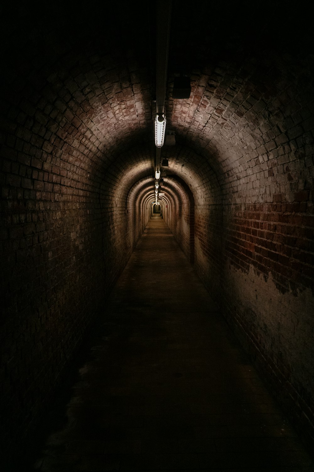 a dark tunnel with a light at the end