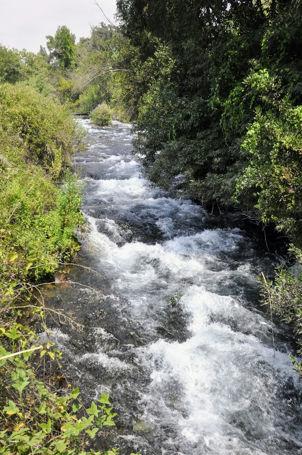 a river with a waterfall