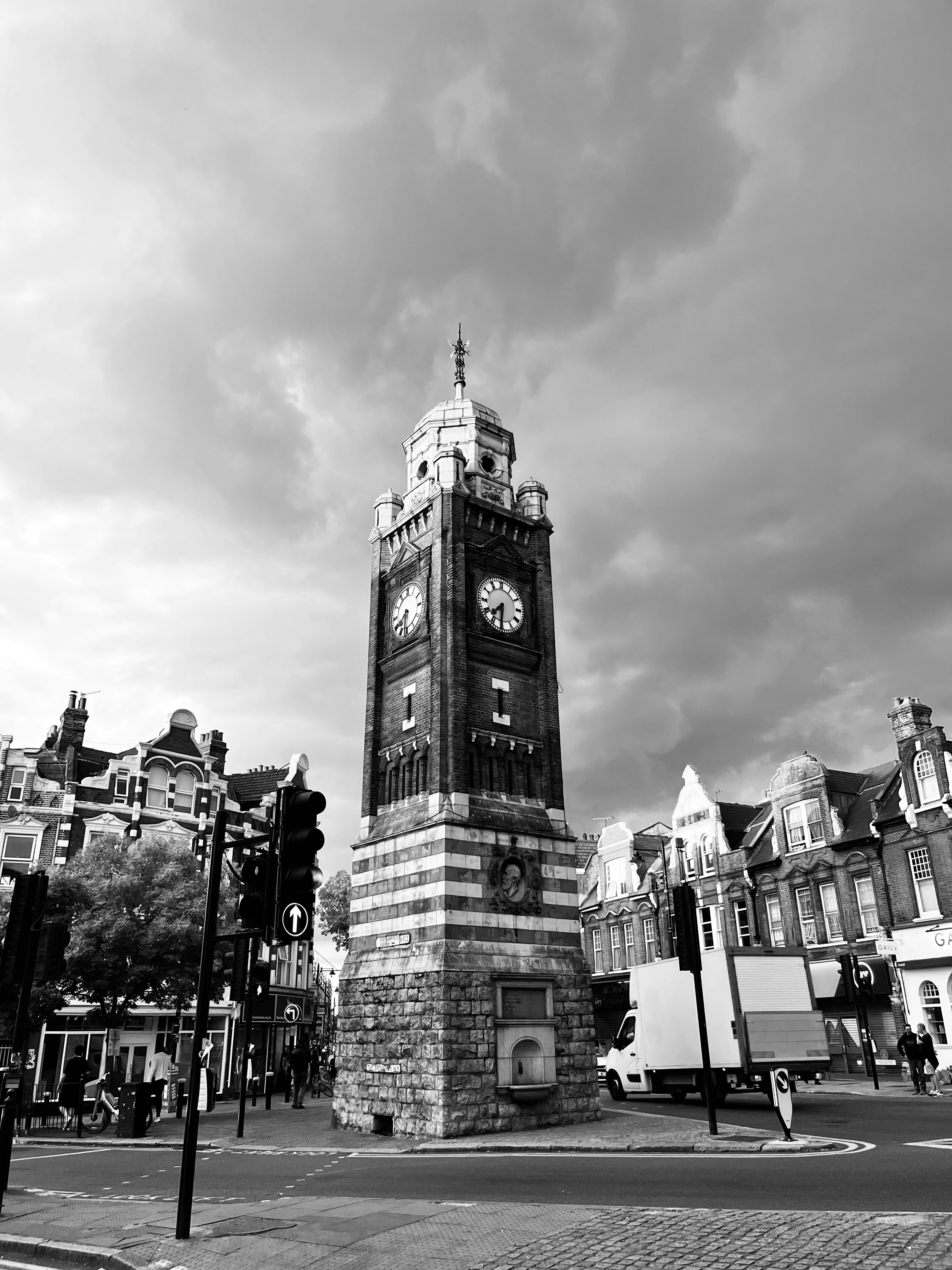 A clock tower in a city photo – Free Architecture Image on Unsplash