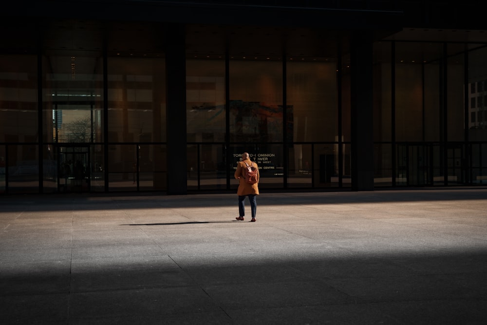 a person walking in front of a building