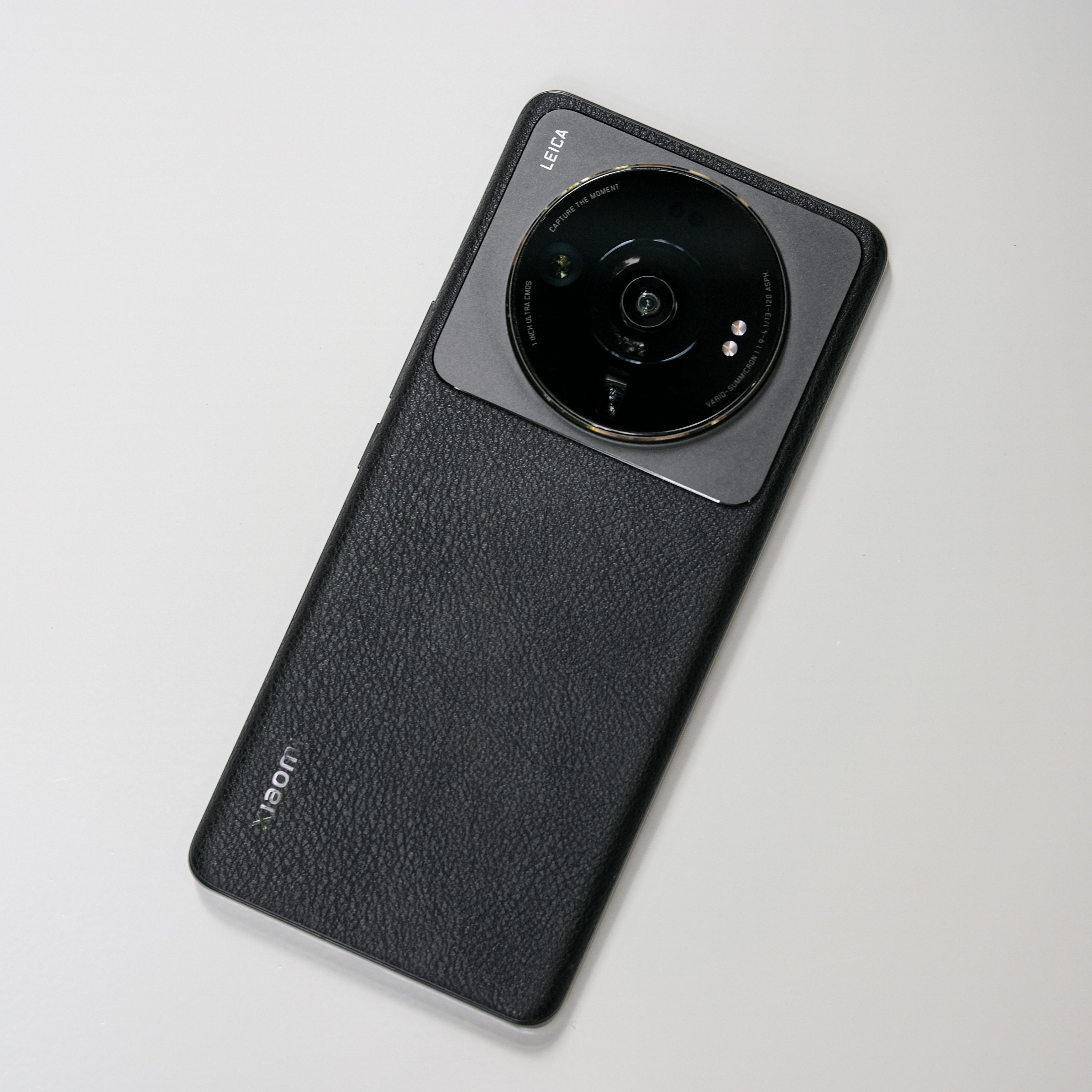Xiaomi flagship smartphone with Leica camera on dark background