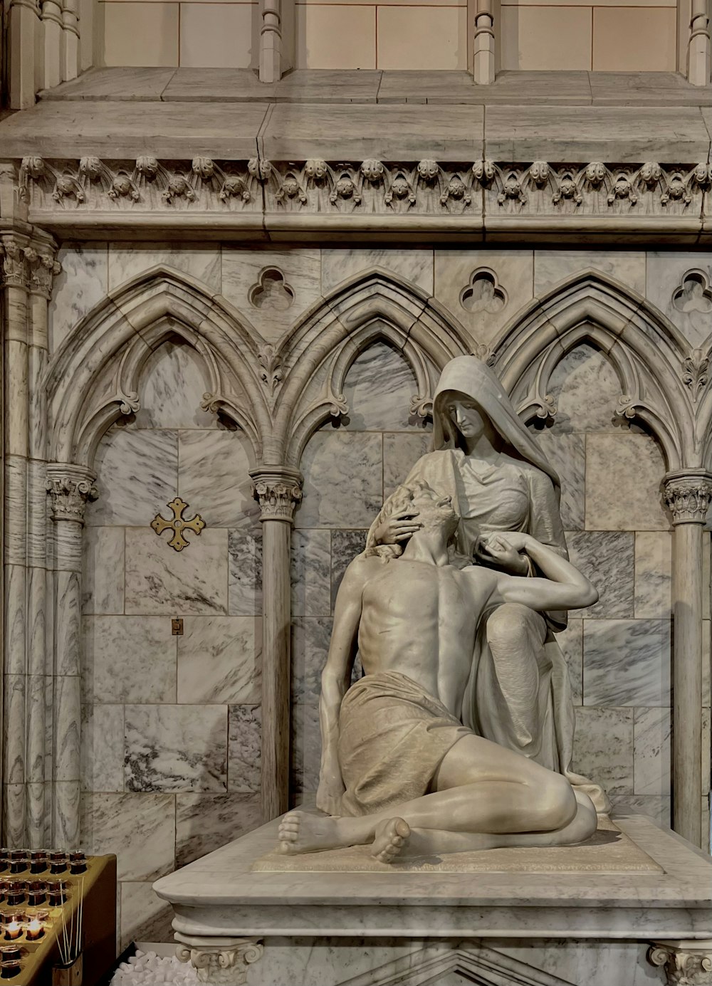 a statue of a woman and a man sitting on a bench