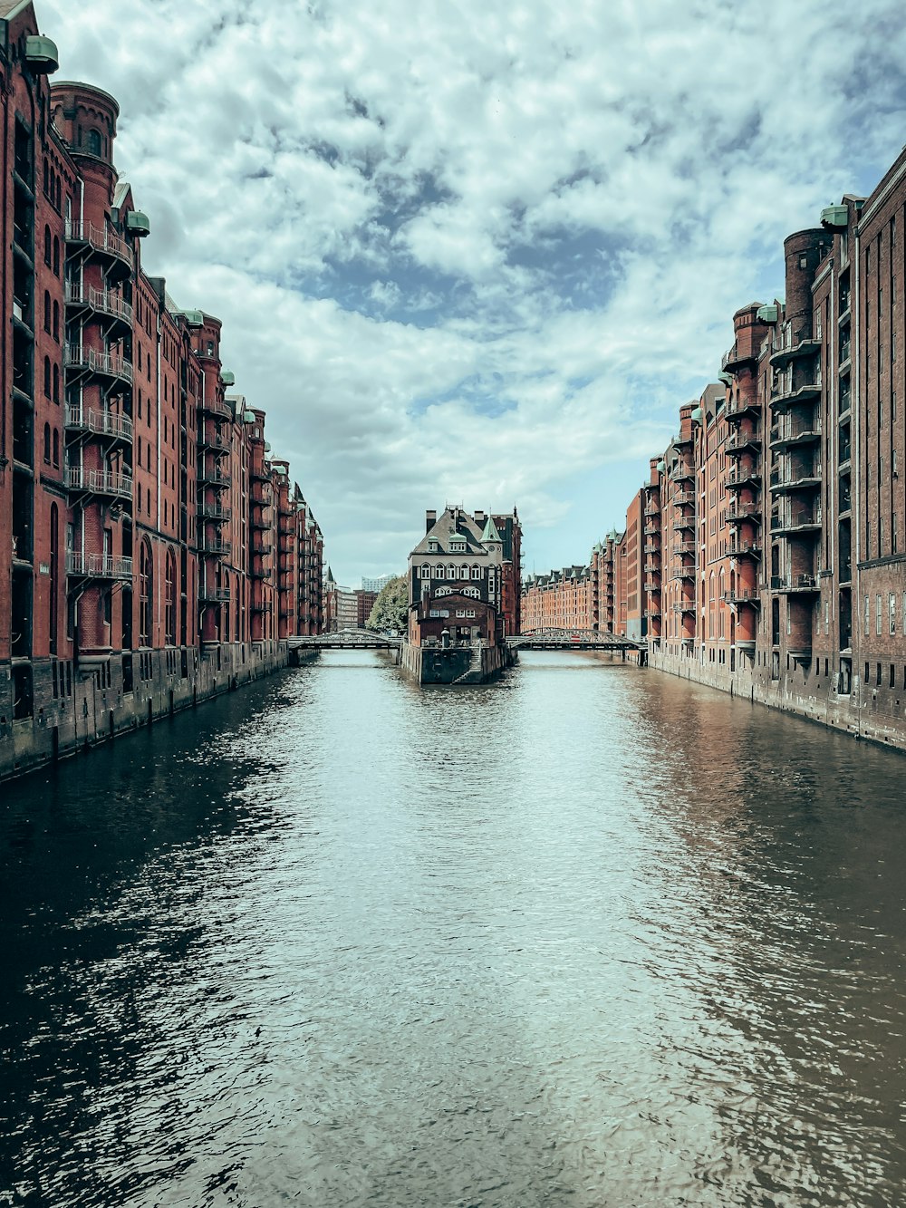 a canal with buildings along it with Grand Canal in the background