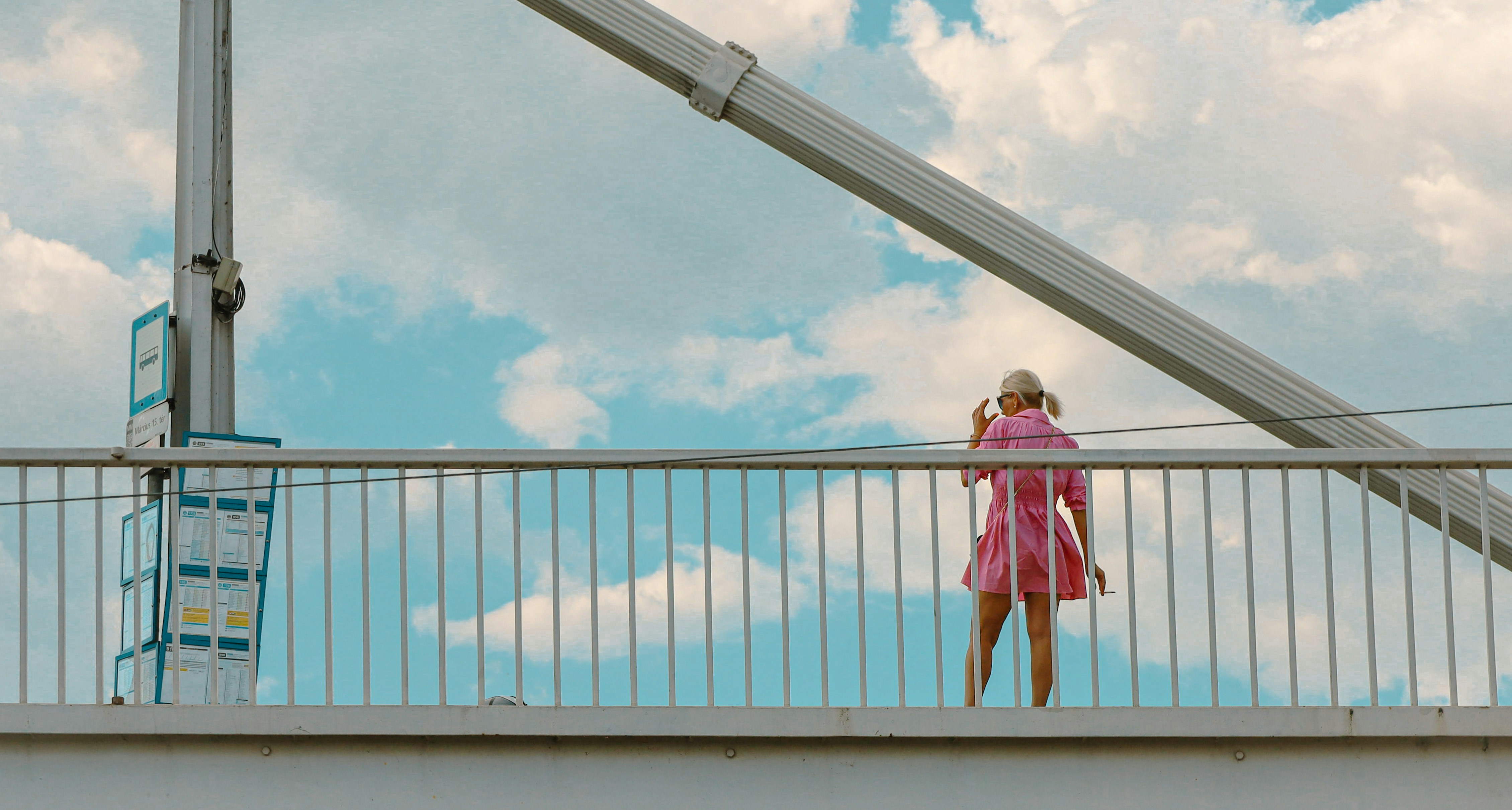 a person standing on a bridge