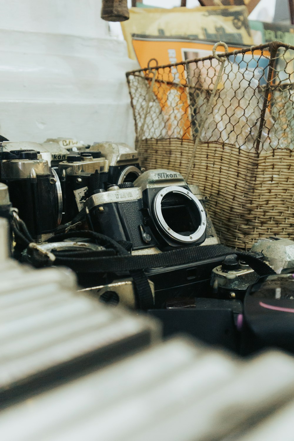a basket and camera on a shelf