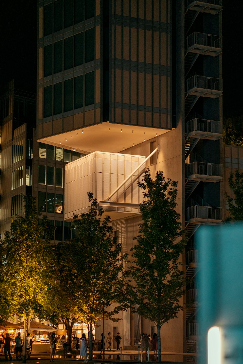 a building with a staircase and trees