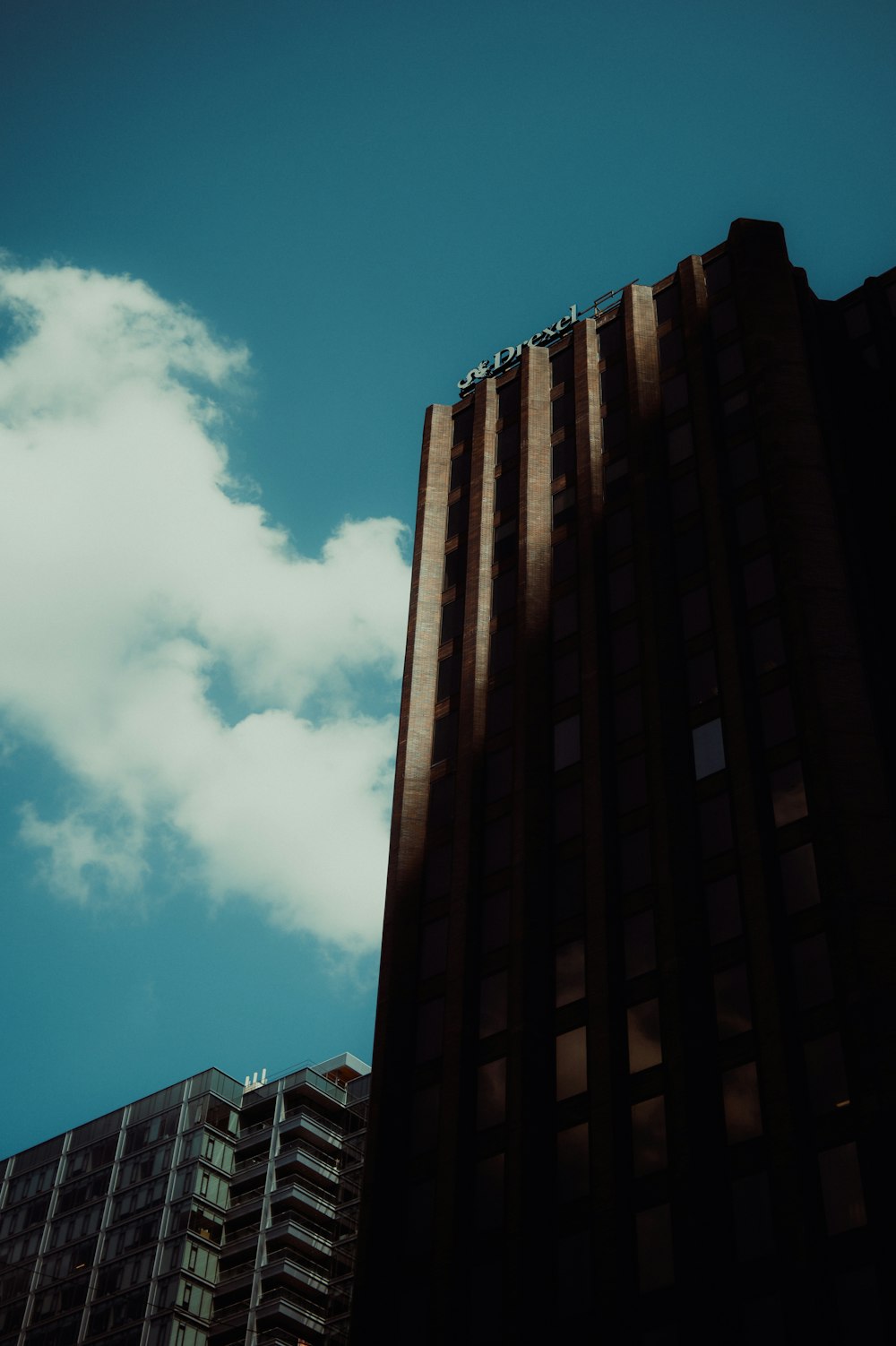 a tall building with a blue sky