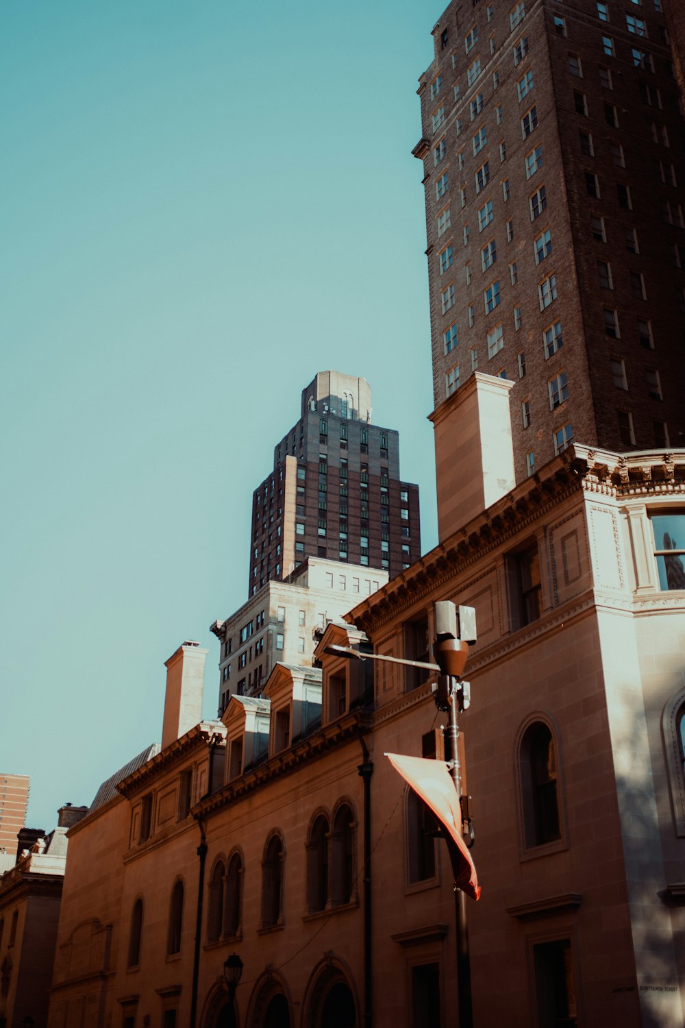 a tall building with a flag on top