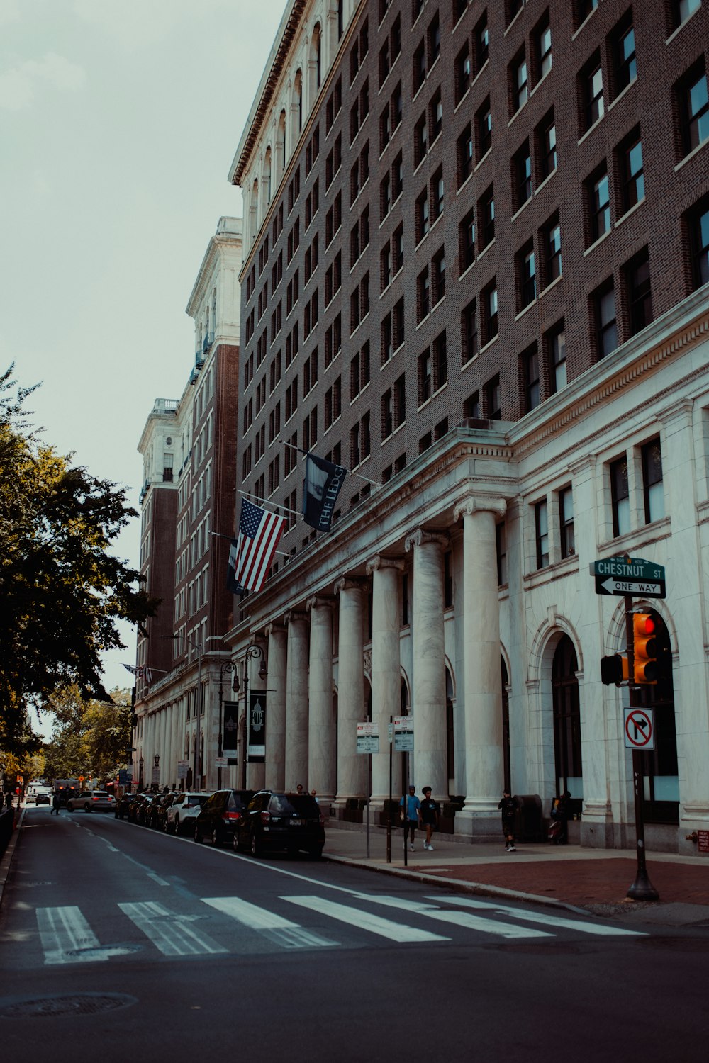 a large building with columns and a flag on top