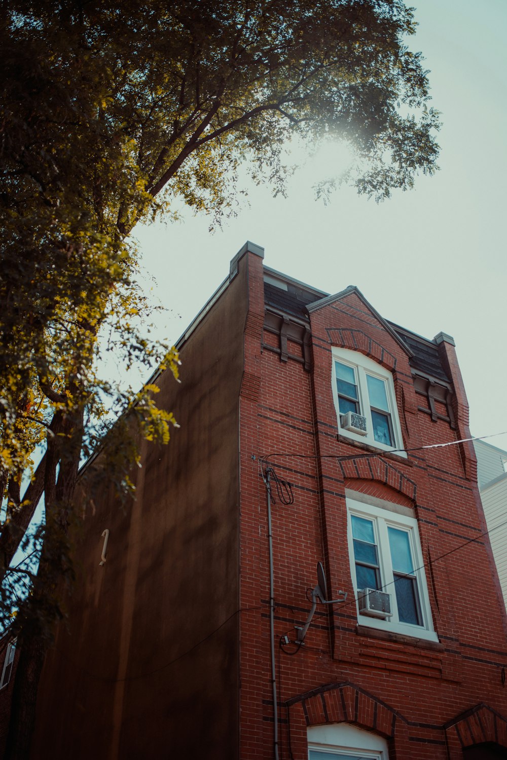 a large brick tower with a clock on the side of a building