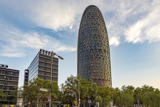 a tall building with trees in front of it