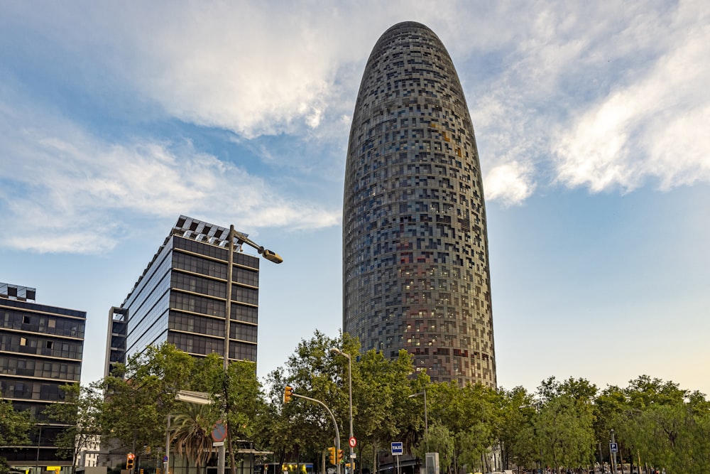 a tall building with trees in front of it