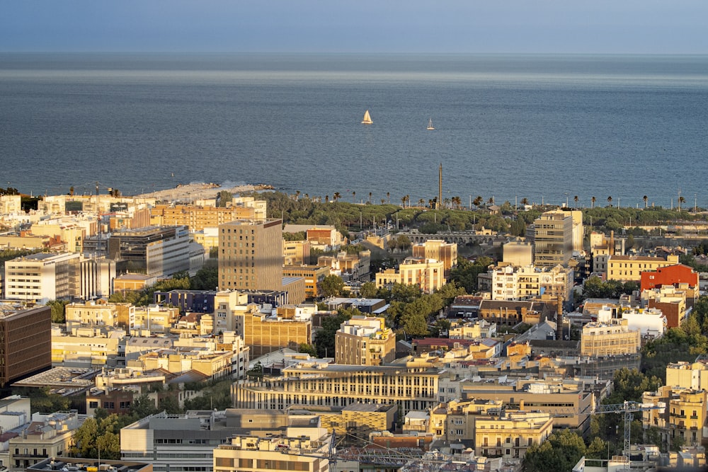 a city with a body of water in the background