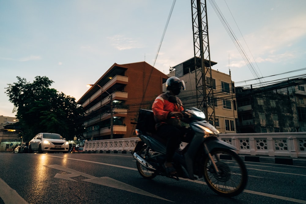 a person riding a motorcycle on the street